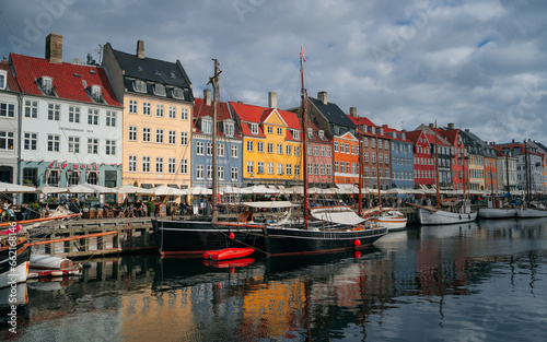 Copenhagen iconic view. Famous old Nyhavn port in the center of Copenhagen  Denmark during winter sunny day