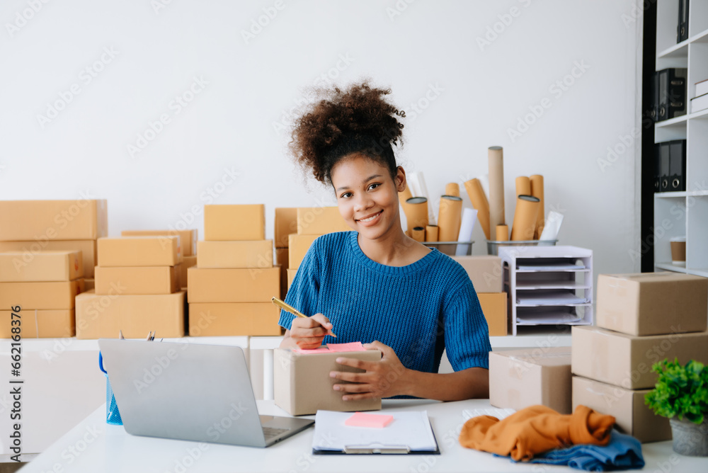 Small business entrepreneur SME freelance woman working at home office, BOX,tablet and laptop online, marketing, packaging, delivery,  e-commerce concept.