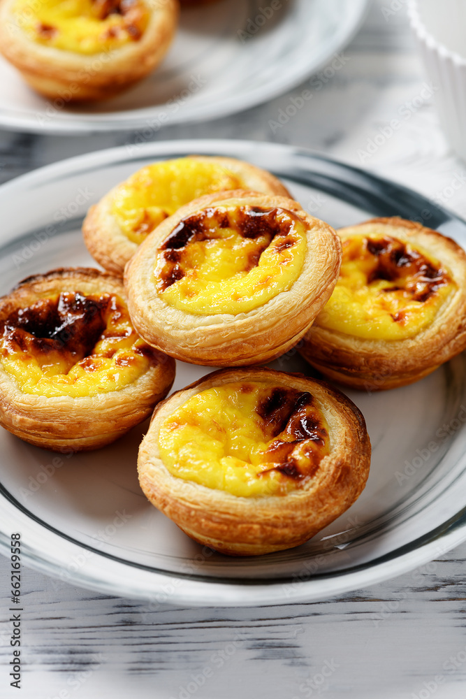 Pastel de nata or Portuguese egg tart. Small tart with a crispy puff pastry crust and a custardy pastry cream filling