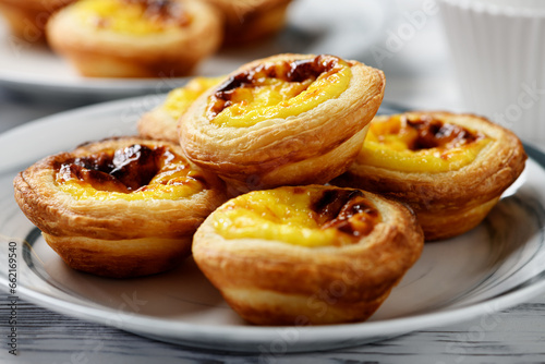 Pastel de nata or Portuguese egg tart. Small tart with a crispy puff pastry crust and a custardy pastry cream filling