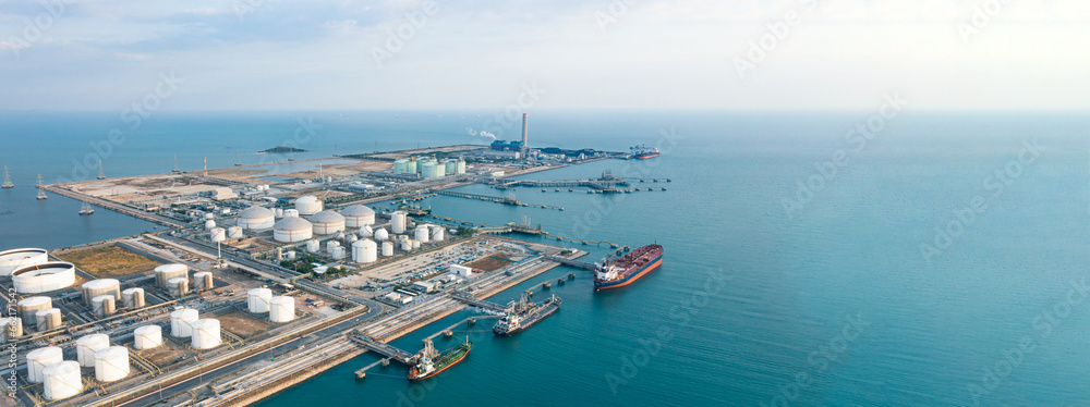 Aerial view or oil terminal is industrial facility for storage tank of oil and lpg Petrochemical. oil manufacturing products ready for transport and business transportation, lpg tank, cng tank