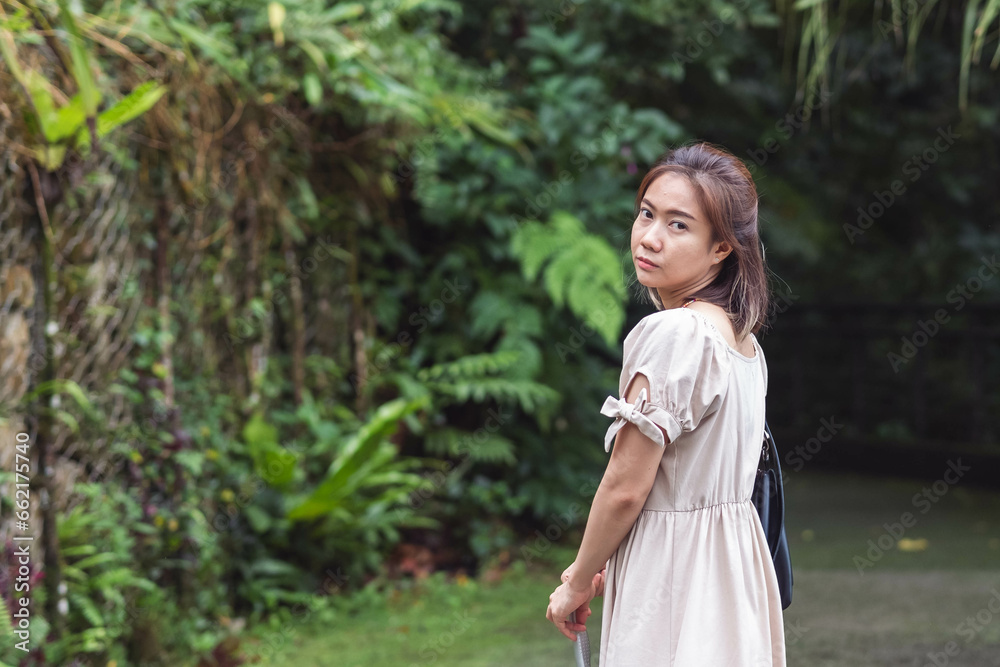 Asian woman travelling, close up of an asian woman feeling relax in the national park. Asian traveler. Asian woman travelling, close up of an asian woman feeling relax in the national park. Asian traveler.