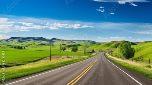 A scenic road with rolling hills and farmland