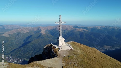 Aerial drone View of the Cross of Heroes on Mount Caraiman in the Bucegi Mountains, Romania. The Commemorative Cross to the Romanian Heroes of the First World War located at 2,291 m altitude
