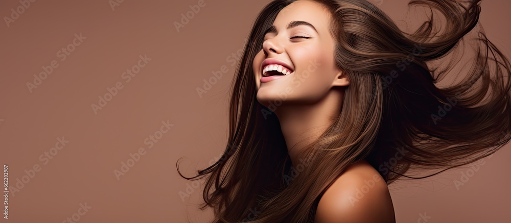 Happy woman swinging long healthy shiny hair satisfied with beauty products With copyspace for text Happy woman swinging long healthy shiny hair satisfied with beauty products With copyspace for text