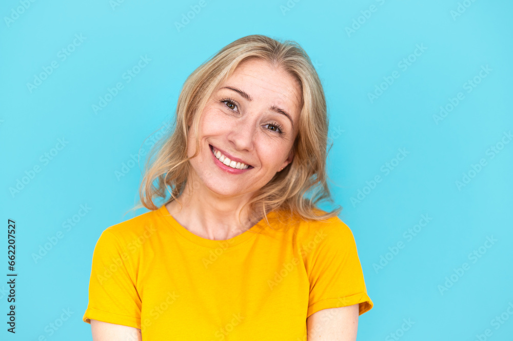 Portrait of happy pleasant woman looking at camera and smiling Portrait of happy pleasant woman looking at camera and smiling