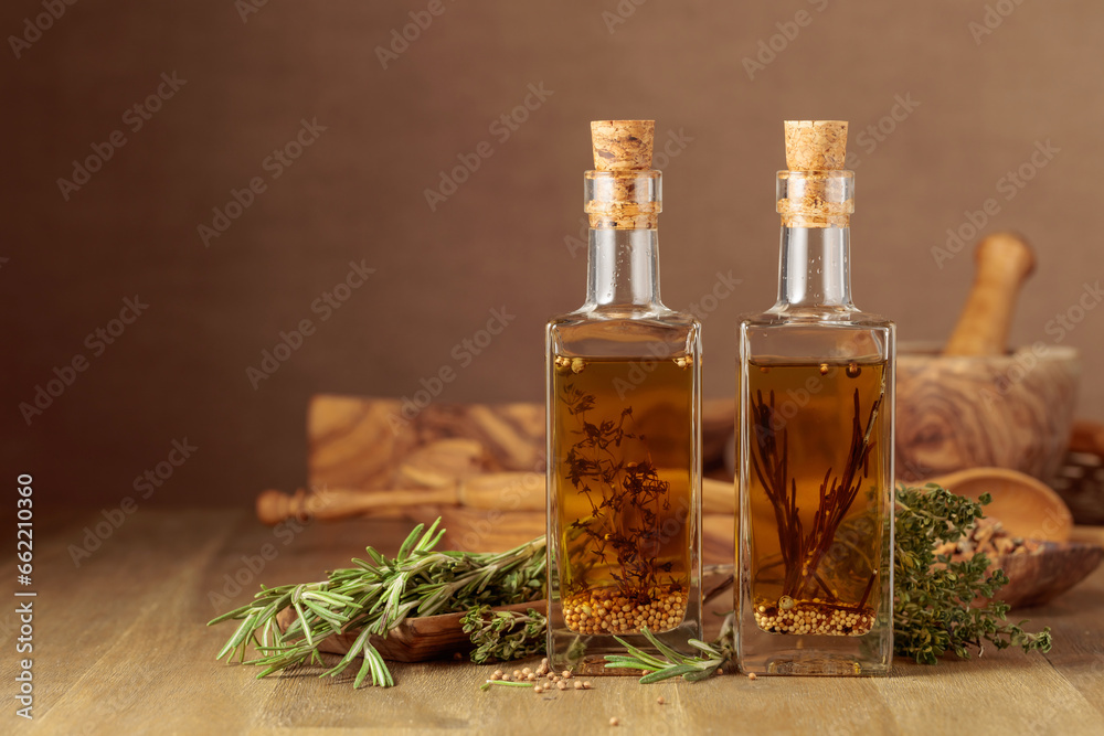 Bottles of olive oil with herbs and spices. Bottles of olive oil with herbs and spices.
