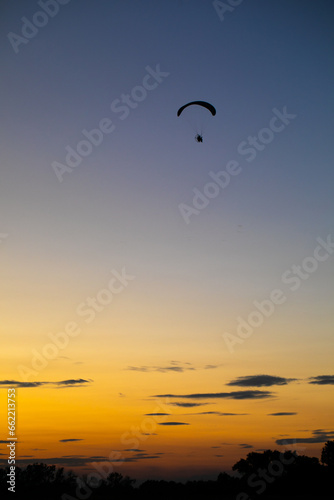 Paraglider over sunset