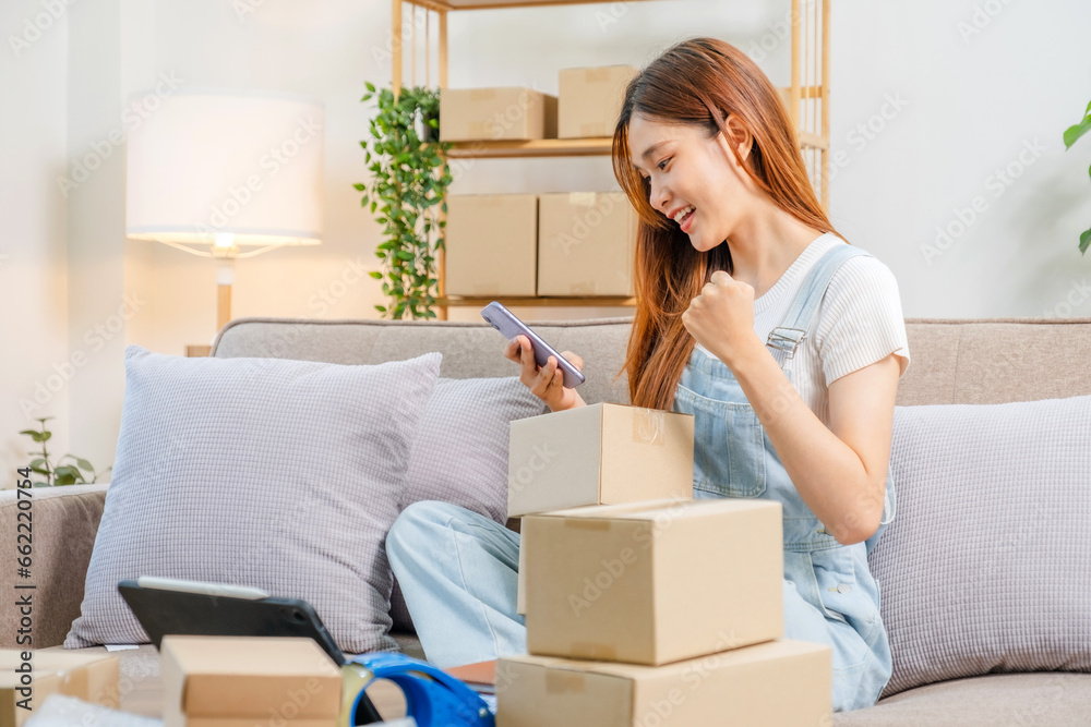 Asian women SME freelance working with packaging startup entrepreneur small business owner at home,Online business seller packaging and delivery concept Asian women SME freelance working with packaging startup entrepreneur small business owner at home,Online business seller packaging and delivery concept