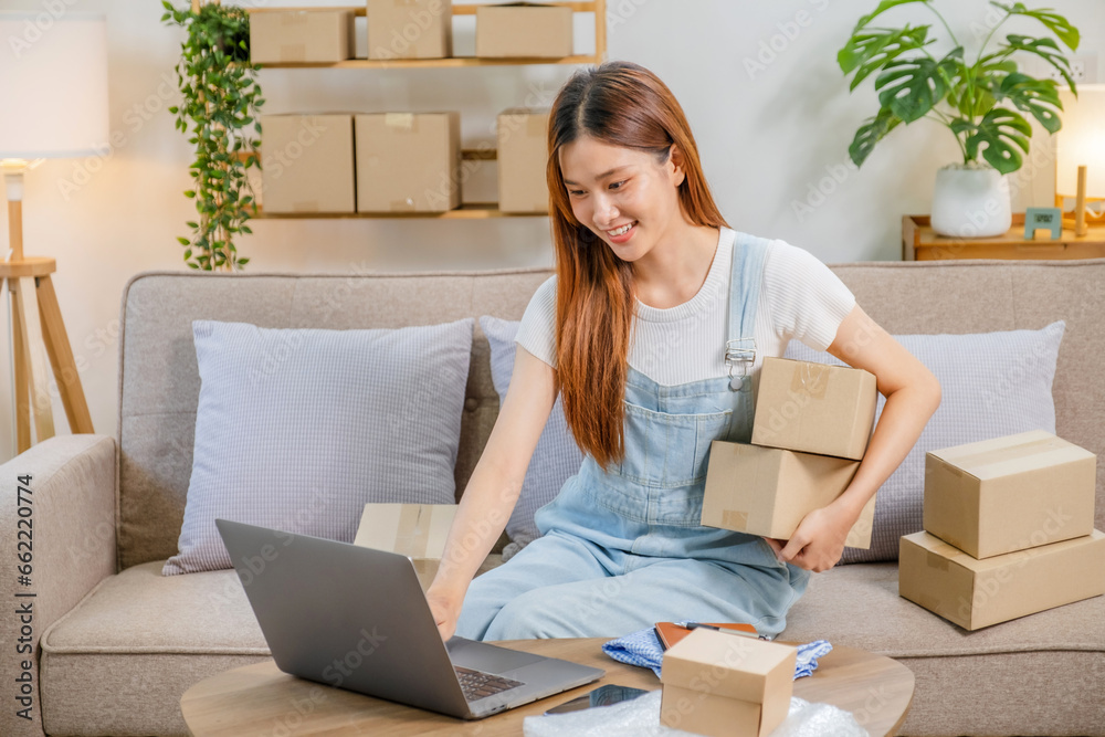 Asian women SME freelance working with packaging startup entrepreneur small business owner at home,Online business seller packaging and delivery concept Asian women SME freelance working with packaging startup entrepreneur small business owner at home,Online business seller packaging and delivery concept