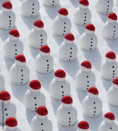 Snowman with read heat on white background, repetitive seamless pattern. Winter, New Year and Christmas holidays background. 