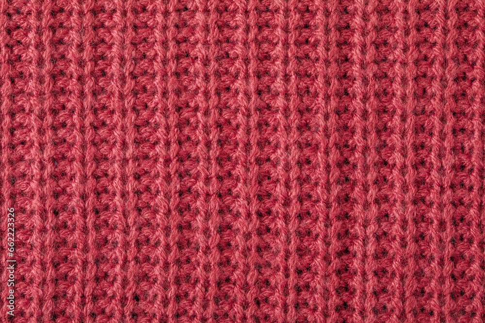 Sweater texture background. Pink knitted texture abstract background