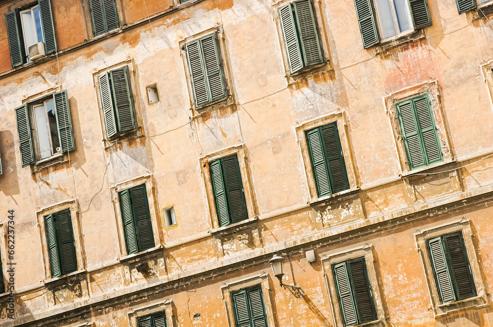 Detail of typical facade of old Roman house with windows