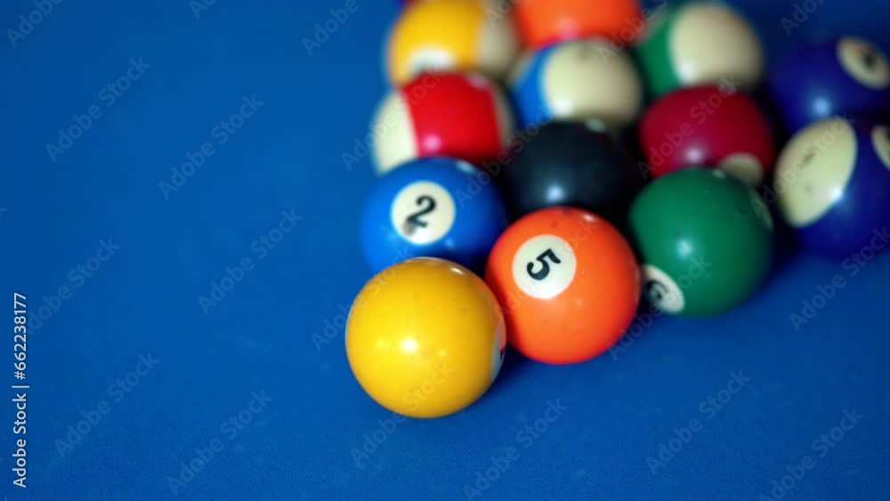 Blue pool table with balls in the rack. billiard balls on a table Blue pool table with balls in the rack. billiard balls on a table