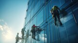 Workers suspended on ropes, meticulously cleaning the windows of a towering skyscraper