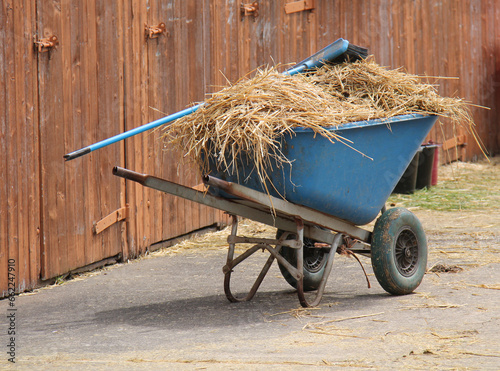 Wallpaper Mural A Wheelbarrow with Straw and a Brush at Horse Stables. Torontodigital.ca