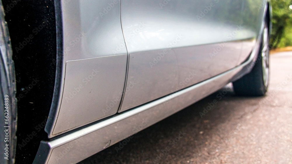 Side of a gray car close up Side of a gray car close up
