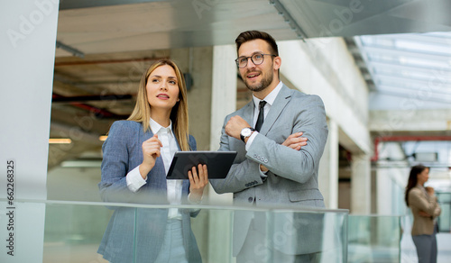 Business couple holding dig...