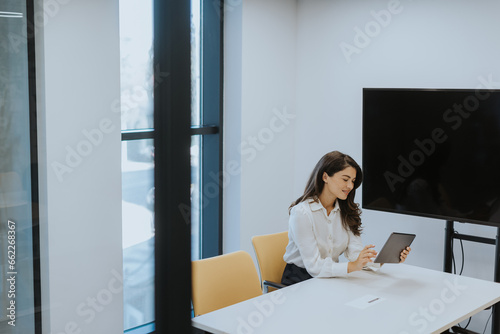 Young woman with digital ta...