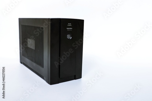 Uninterruptible power supply (UPS) on white background, computer running short time when power interrupted, energy storage back up power with battery, stabilizer for pc and electrical appliance.