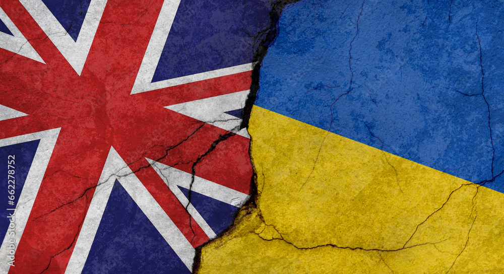 Fototapeta premium Great Britain and Ukraine flags, concrete wall texture with cracks, grunge background, military conflict concept