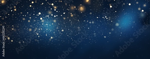 Amazing Christmas. shiny bokeh lights and glitter on dark blue background. Starry space night sky backdrop.