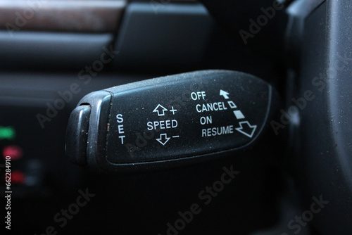 Cruise control switch. Car detail. Modern car interior. Speed limitation and cruise control buttons on modern car photo