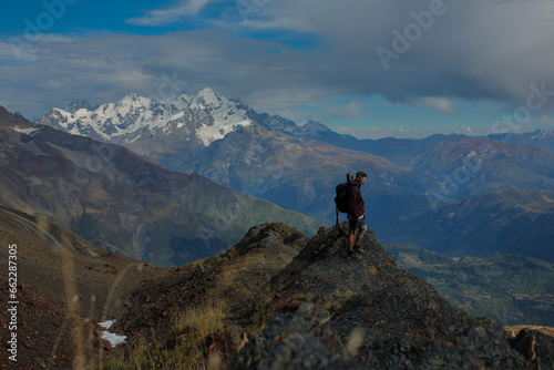 Man in the mountains with a backpack.