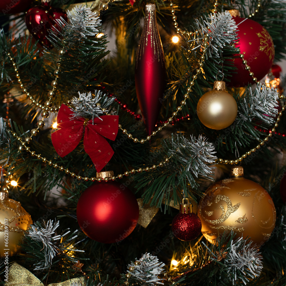 Red and golden baubles on christmas tree for background. New Year concept. Red and golden baubles on christmas tree for background. New Year concept.
