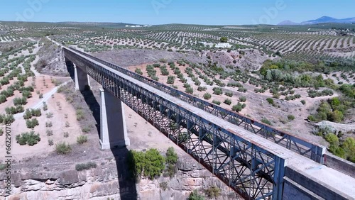 Viaducts and landscape of olive groves on the Via Verde de Guadalimar. Aerial view from a drone. Via Verdes de Jaen. Linares. Province of Jaen. Andalusia. Spain. Europe photo