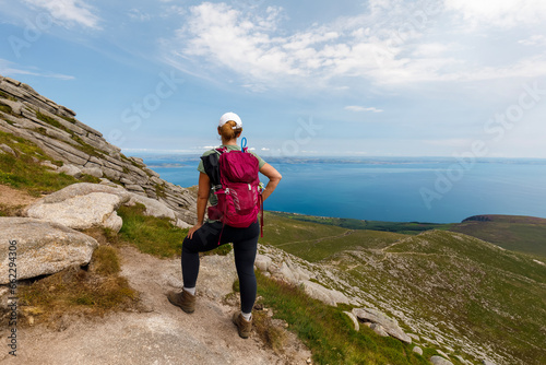 Hiker on path to Goatfell, view over Firth of Clyde, summers day.