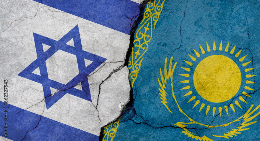 Israel and Kazakhstan flags, concrete wall texture with cracks, grunge background, military conflict concept