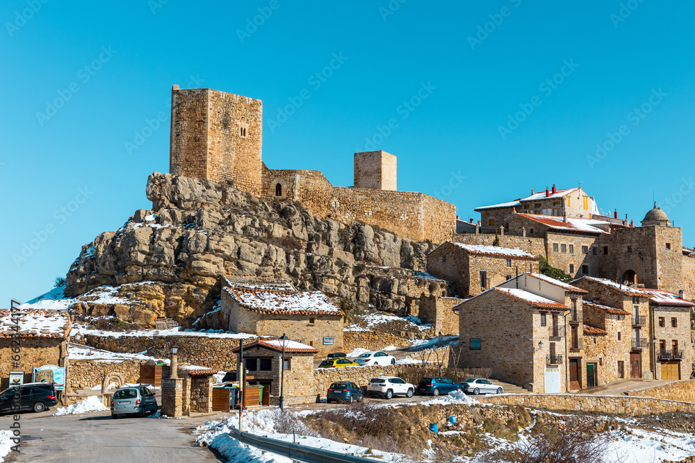 View of the medieval village of Puertomingalvo, Teruel, Spain, with its castle.