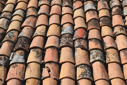 Old weathered traditional terracotta roof tiles