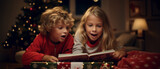 siblings reading a book in a christmasy living room at night