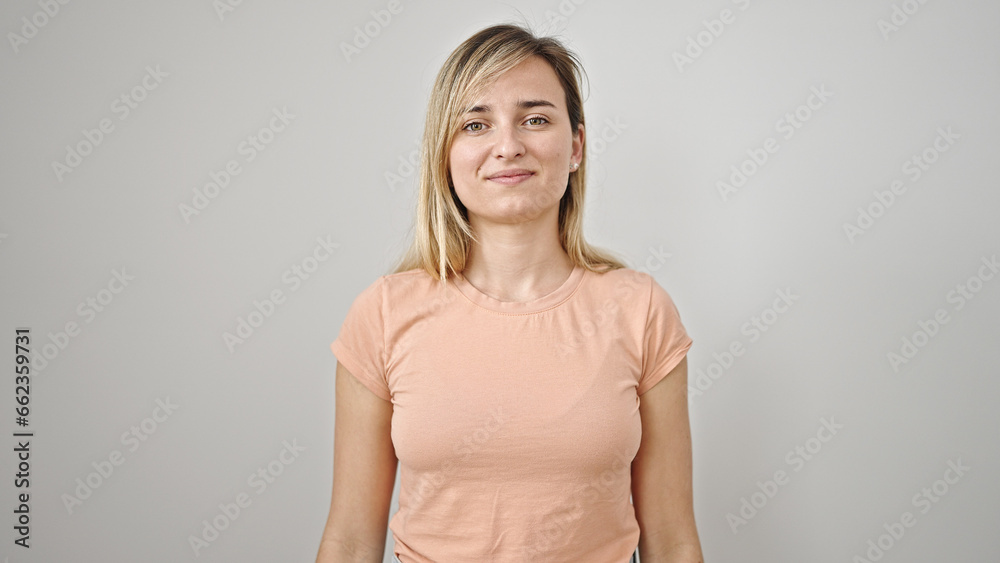 Obraz premium Young blonde woman smiling confident standing over isolated white background