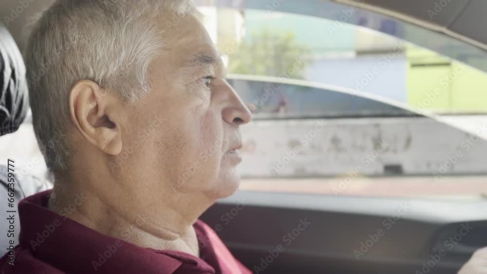 Seasoned Driver, Elderly Taxi and App Driver Navigates São Paulo Suburbs on Sunny Day, Engaging with Passenger Seasoned Driver, Elderly Taxi and App Driver Navigates São Paulo Suburbs on Sunny Day, Engaging with Passenger