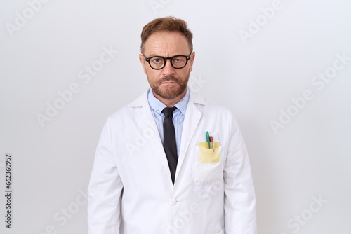 Middle age doctor man with beard wearing white coat skeptic and nervous, frowning upset because of problem. negative person.