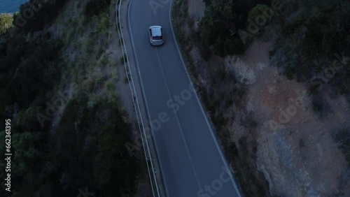 Argentario Italy June 02 2023: Aerial view of a car on the road of Monte Argentario