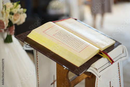 During the church wedding of the newlyweds, the Gospel is read in Cyrillic.