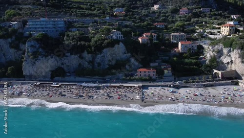 aerial view of the sea and the beach with bathers in Finale Ligure