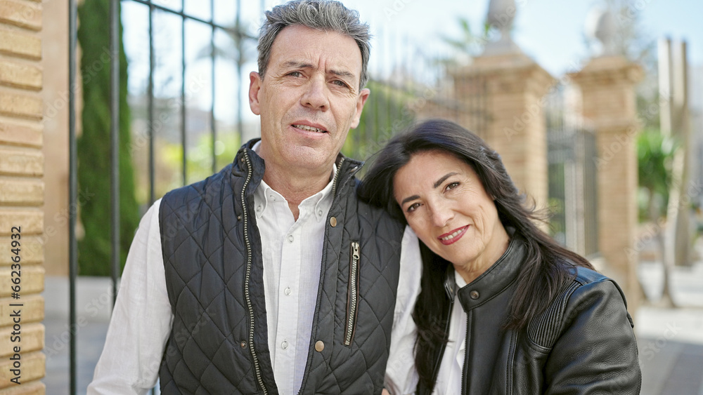 Senior man and woman couple smiling confident standing together at street Senior man and woman couple smiling confident standing together at street