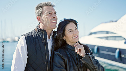 Senior man and woman couple smiling confident standing together at port © Krakenimages.com