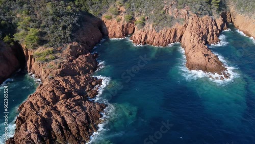 aerial view of the sea crashing on the rocks in the French Riviera