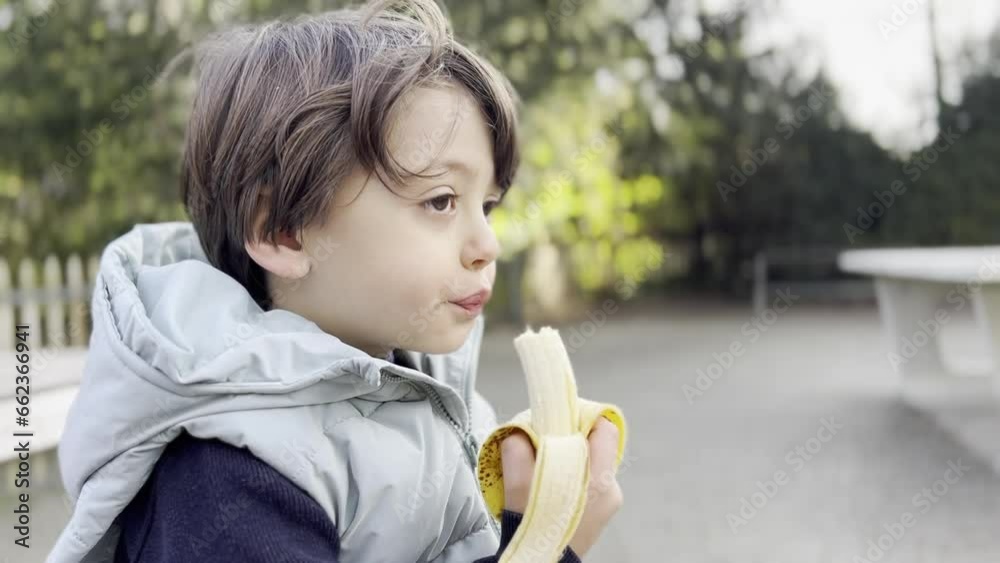 Healthy Snack Time, Boy Enjoying a Banana in the Park, Afternoon Routine Healthy Snack Time, Boy Enjoying a Banana in the Park, Afternoon Routine