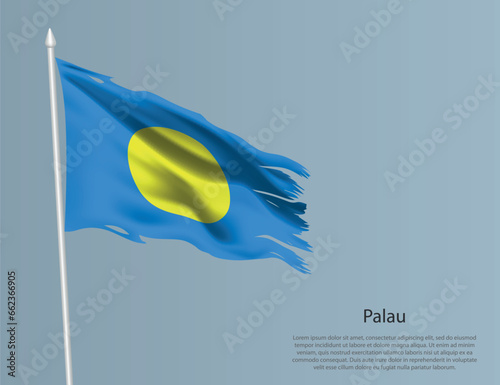 Ragged national flag of Palau. Wavy torn fabric on blue background.