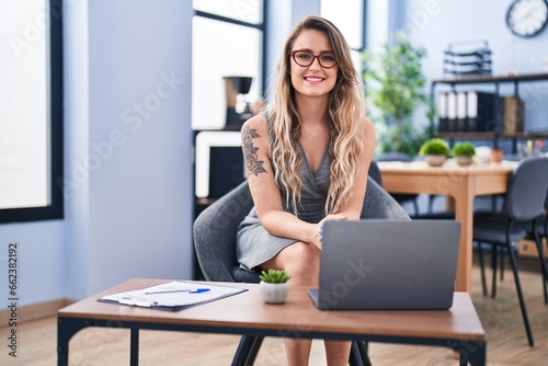 Young woman business worker smiling confident at office