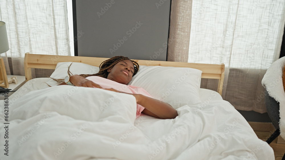 African american woman lying on bed sleeping at bedroom African american woman lying on bed sleeping at bedroom