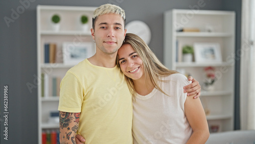 Beautiful couple smiling confident hugging each other at home © Krakenimages.com