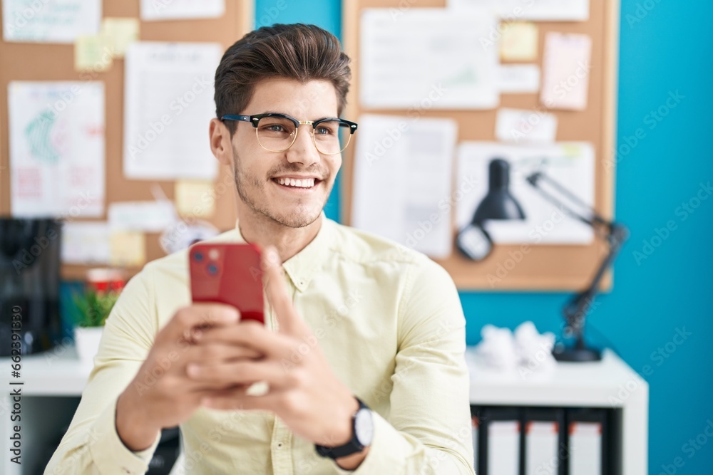 Young hispanic man business worker using smartphone working at office Young hispanic man business worker using smartphone working at office